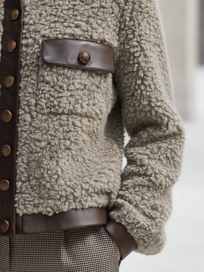 Veste en fausse fourrure à col rond avec élégantes finitions en simili cuir vintage